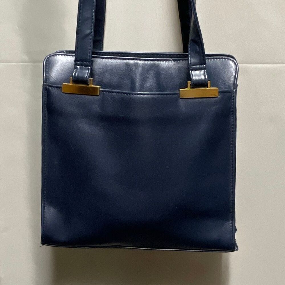 Vintage Colette blue leather shoulder bag.